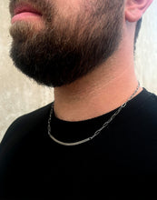 Load image into Gallery viewer, A person with a beard wearing a silver necklace with a bar pendant.
